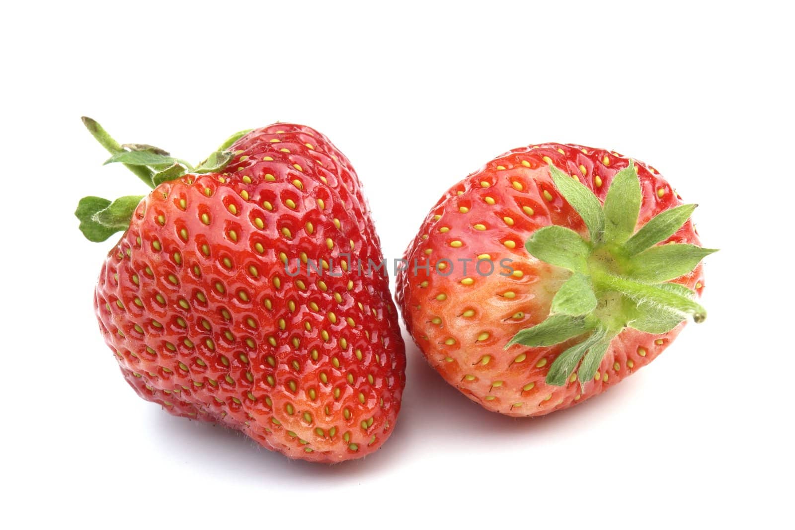 two strawberries on the white background