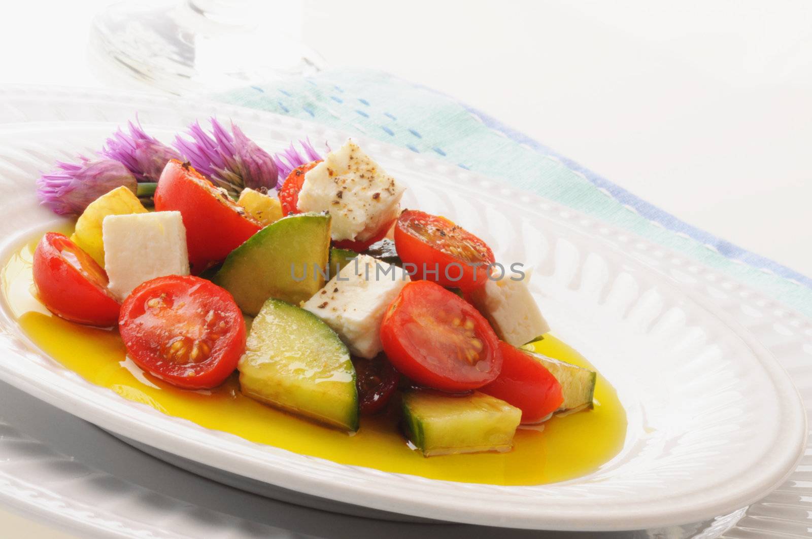 Delicious tomato and cucumber salad with balsamic dressing.