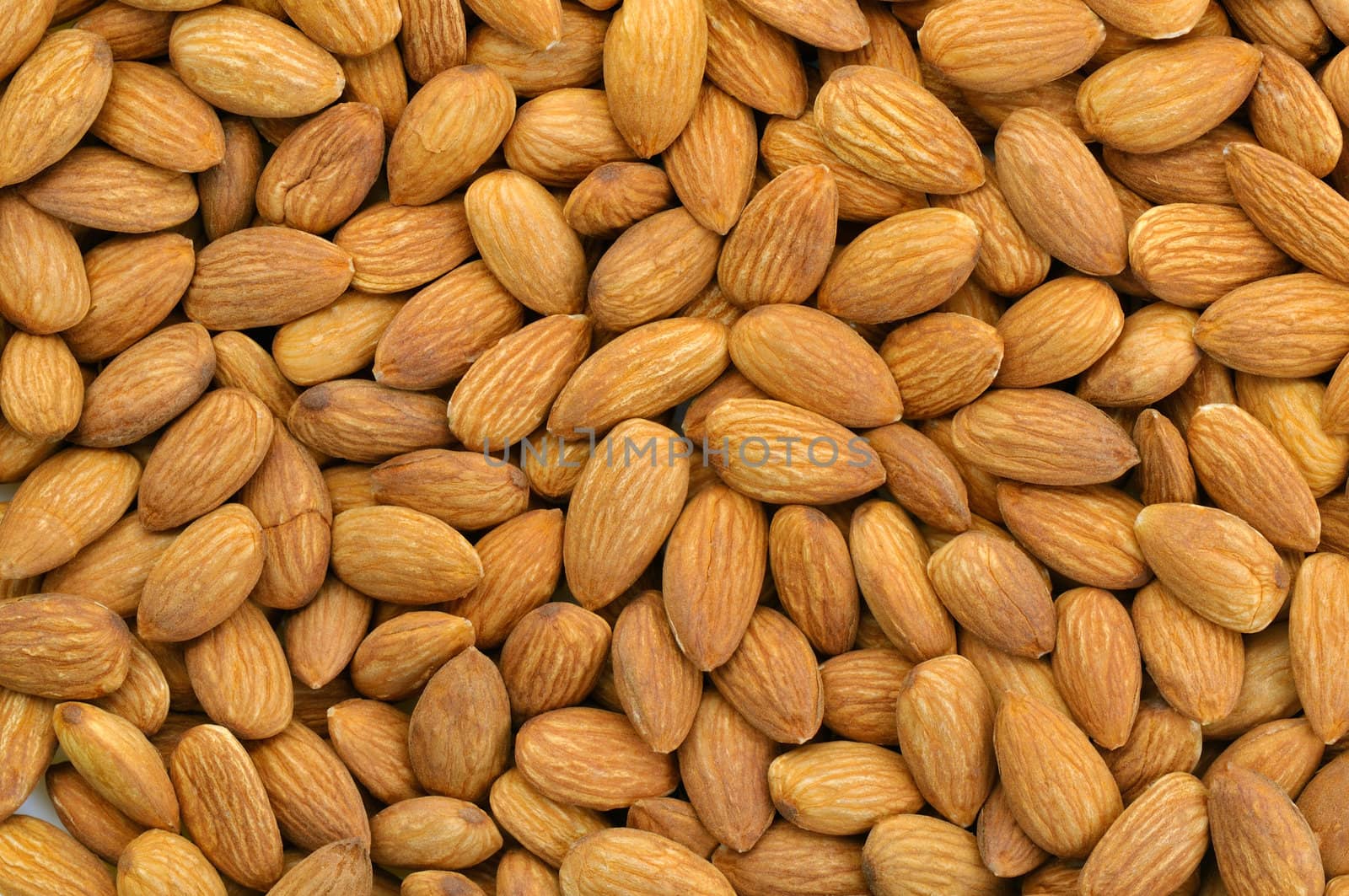 Top view of peeled almonds in natural light