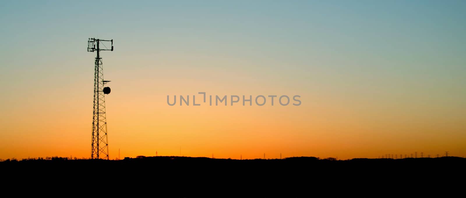 Pale Blue Cell Phone Tower Sunset
 by ca2hill
