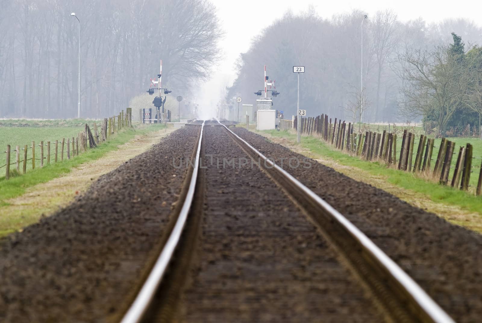 Railtrack with hazy crossing. by Gertje