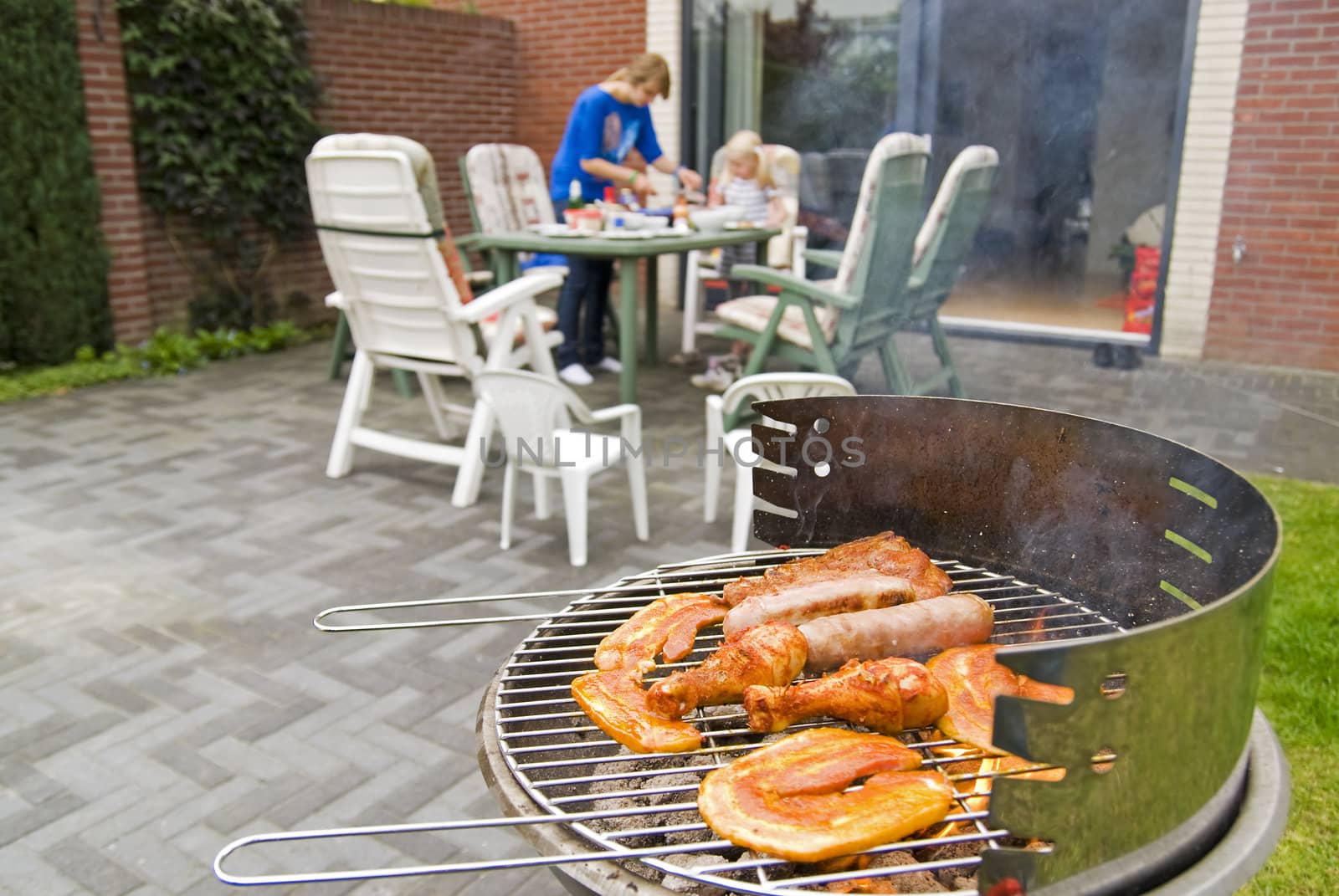 Meat and kebabs on barbecue. by Gertje