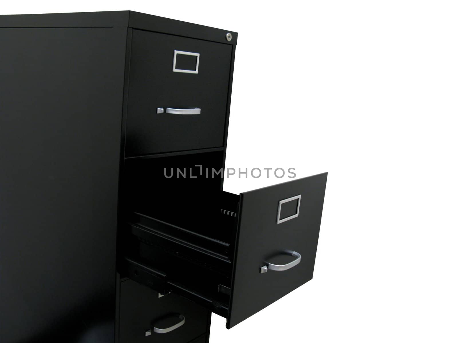 Black filing cabinet with open empty drawer, at an angle.