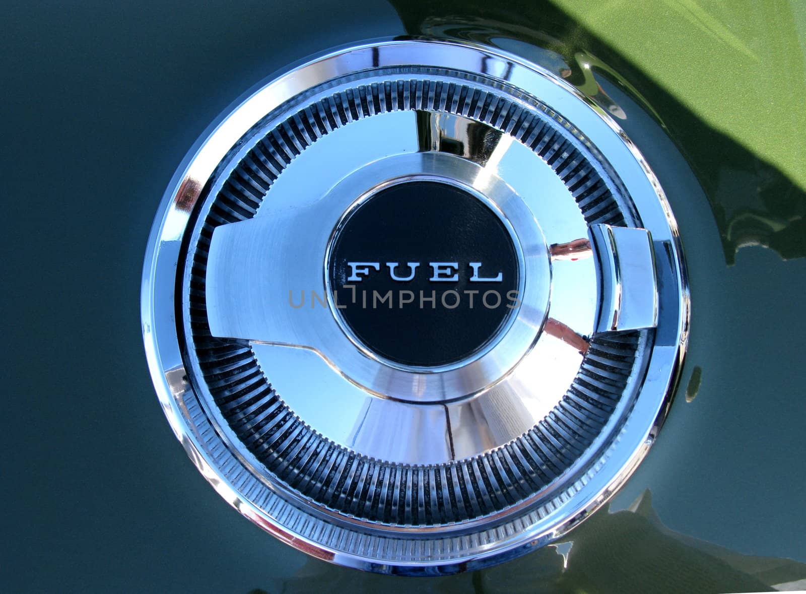 Gas cap labeled "FUEL" from a 1970's car.