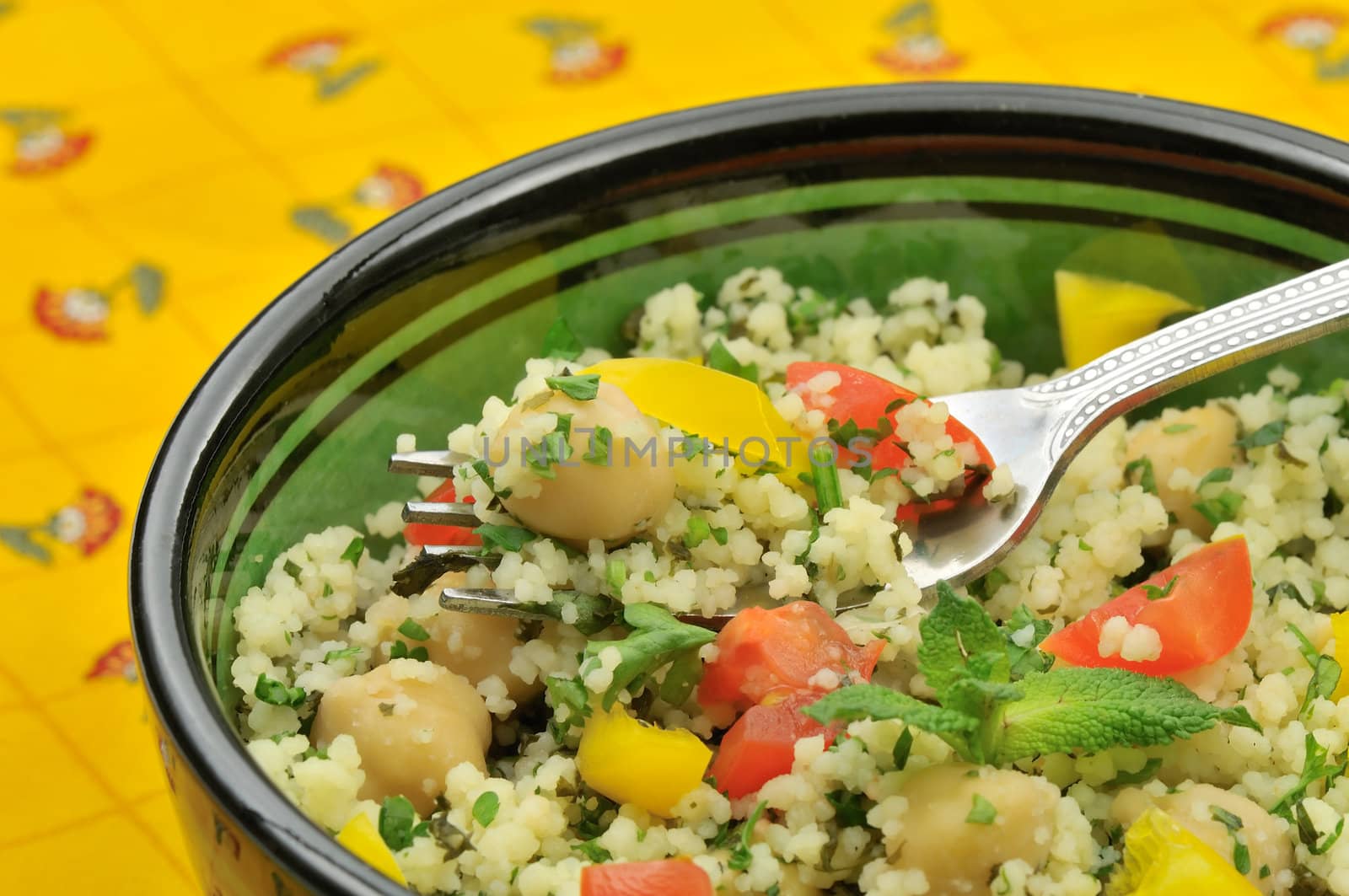 Macro of mediterranean couscous salad served in a Moroccan bowl