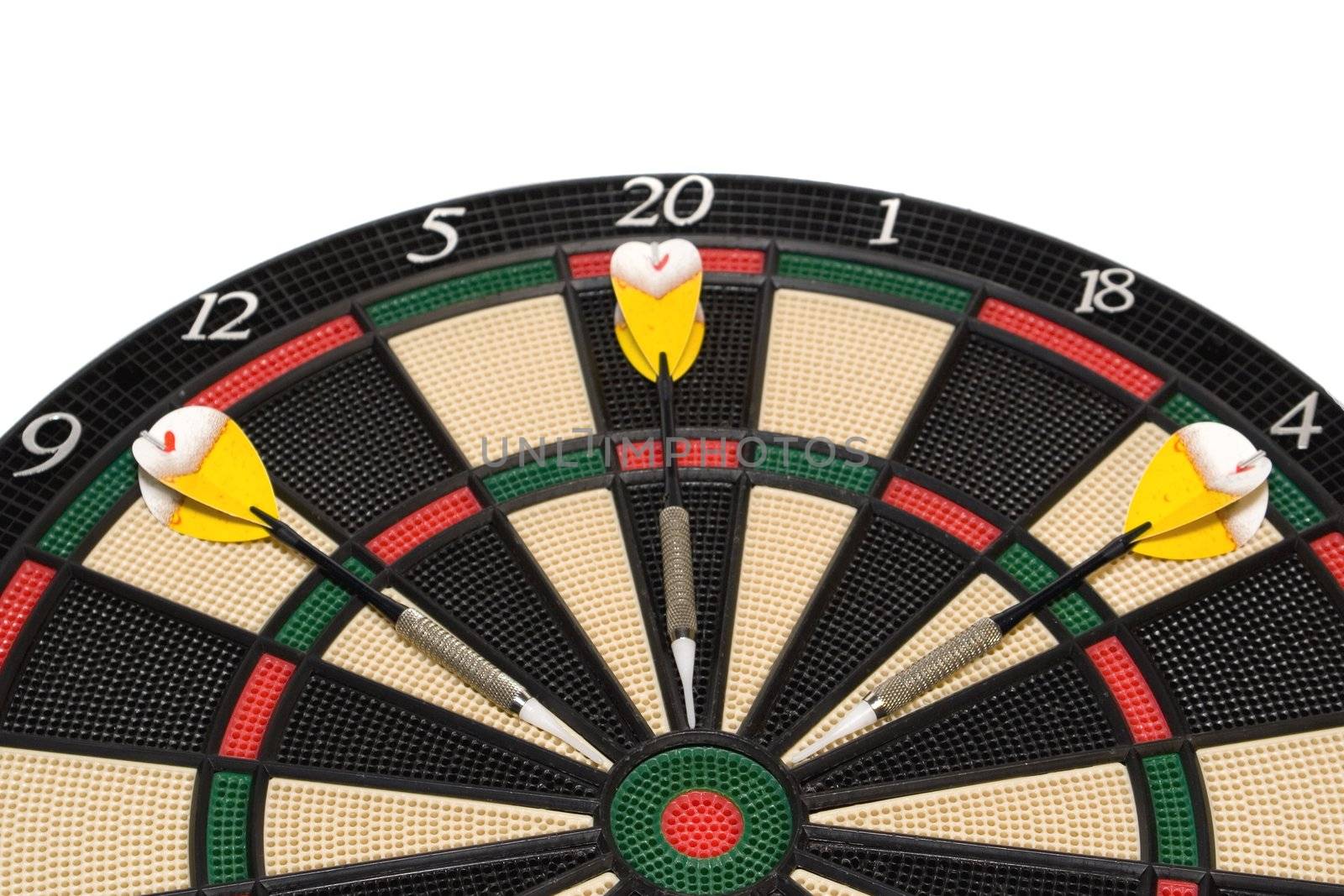 Darts hitting the bullseye on a dartboard