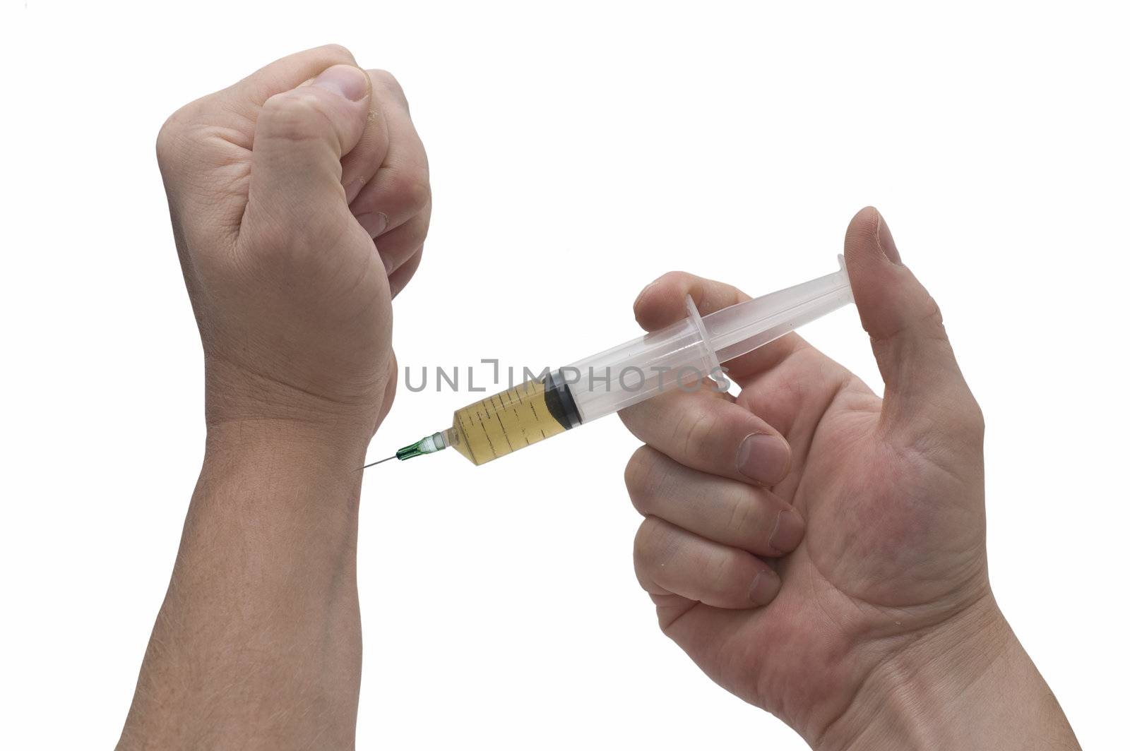 an isolated over white image of a caucasian man's hands holding about to inject a hyperdermic needle. uses could include drug addiction or self medication.