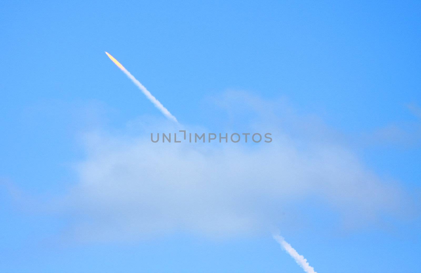Vapor trail of Space Shuttle Discovery as it launches successfully from Cape Canaveral at 5:02 PM, EST.