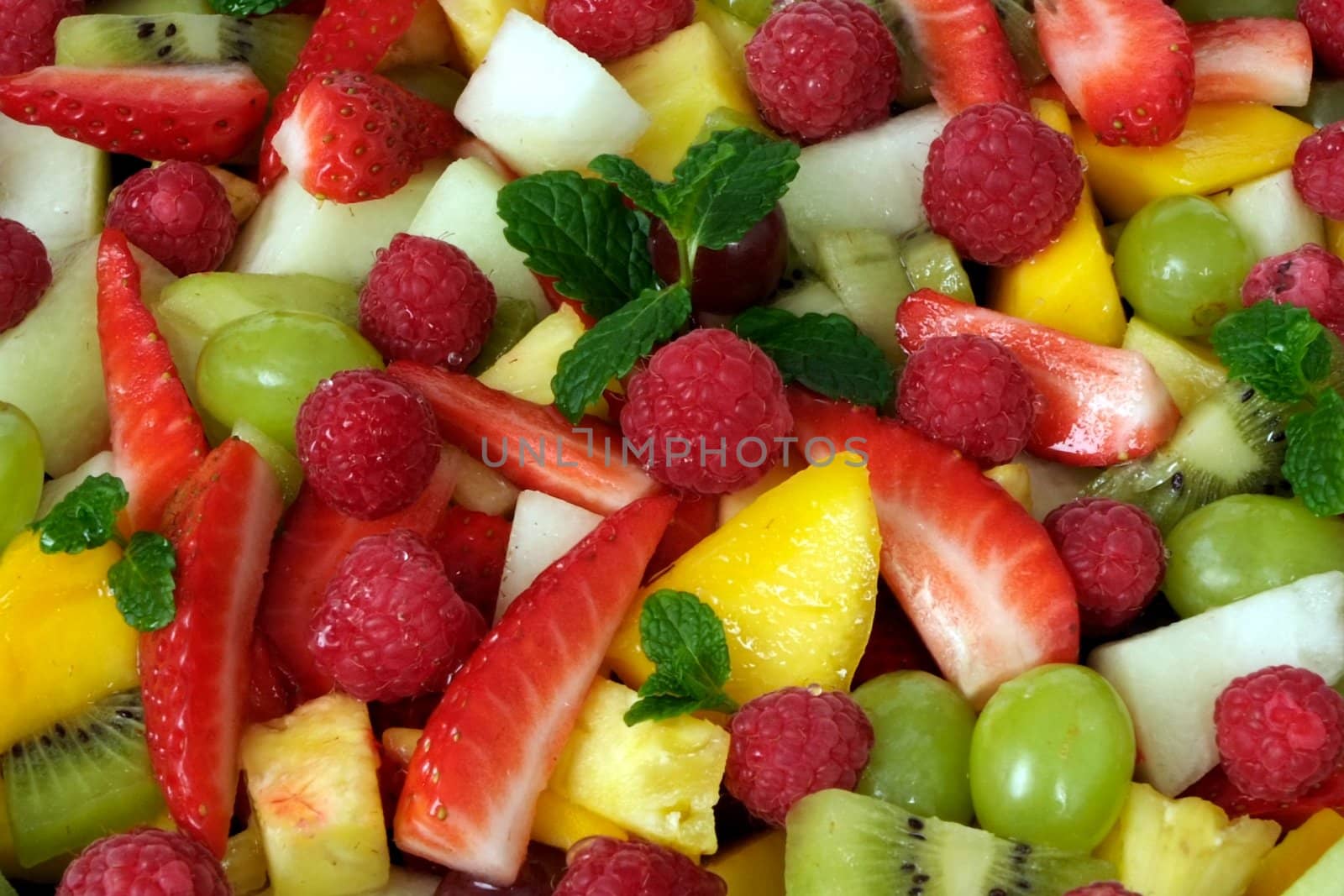 A mixture of fresh fruit prepared for a salad