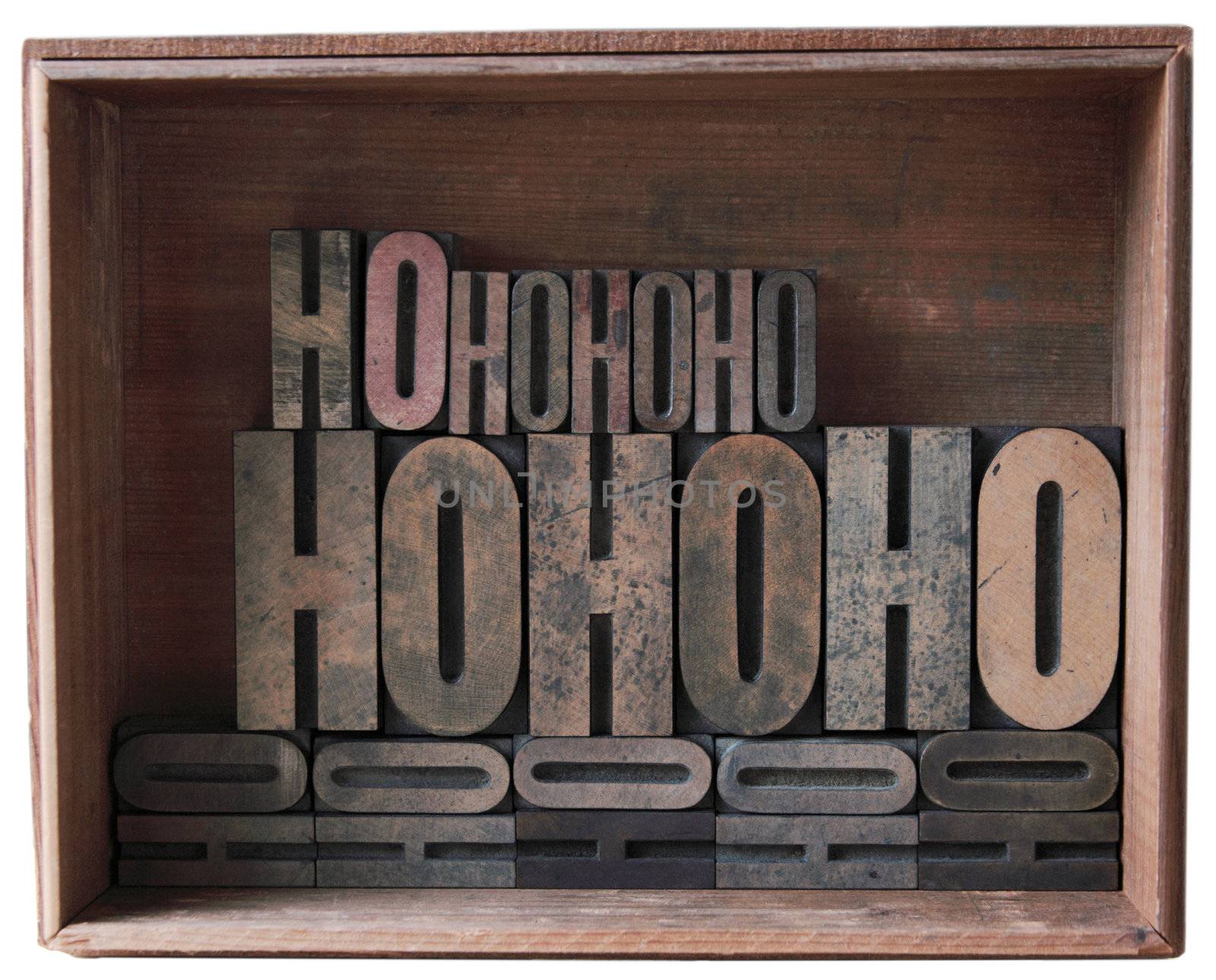 a wooden box filled with 'ho ho ho' in different sizes of wood type
