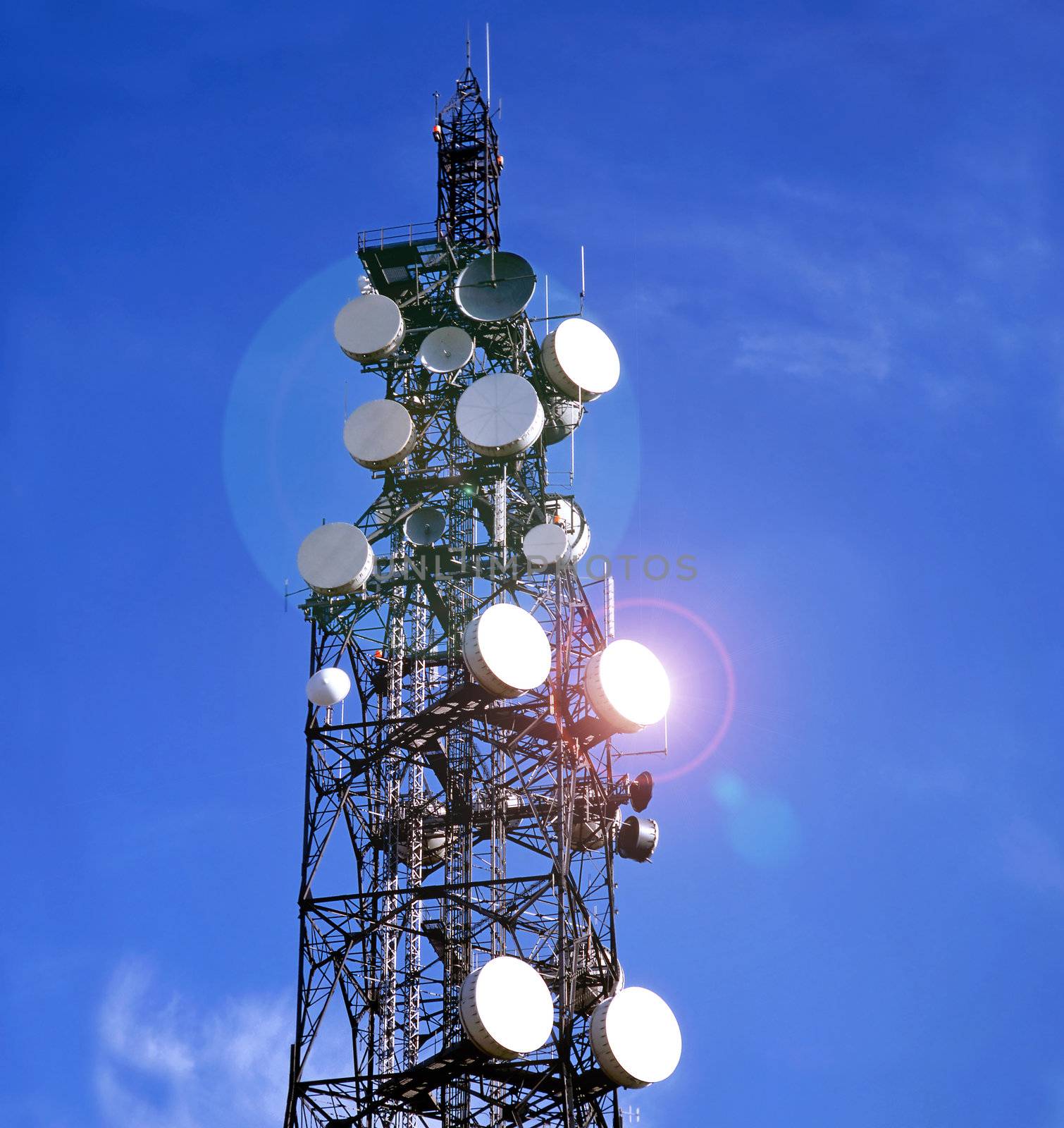 Telecommunication mast with blue sky background