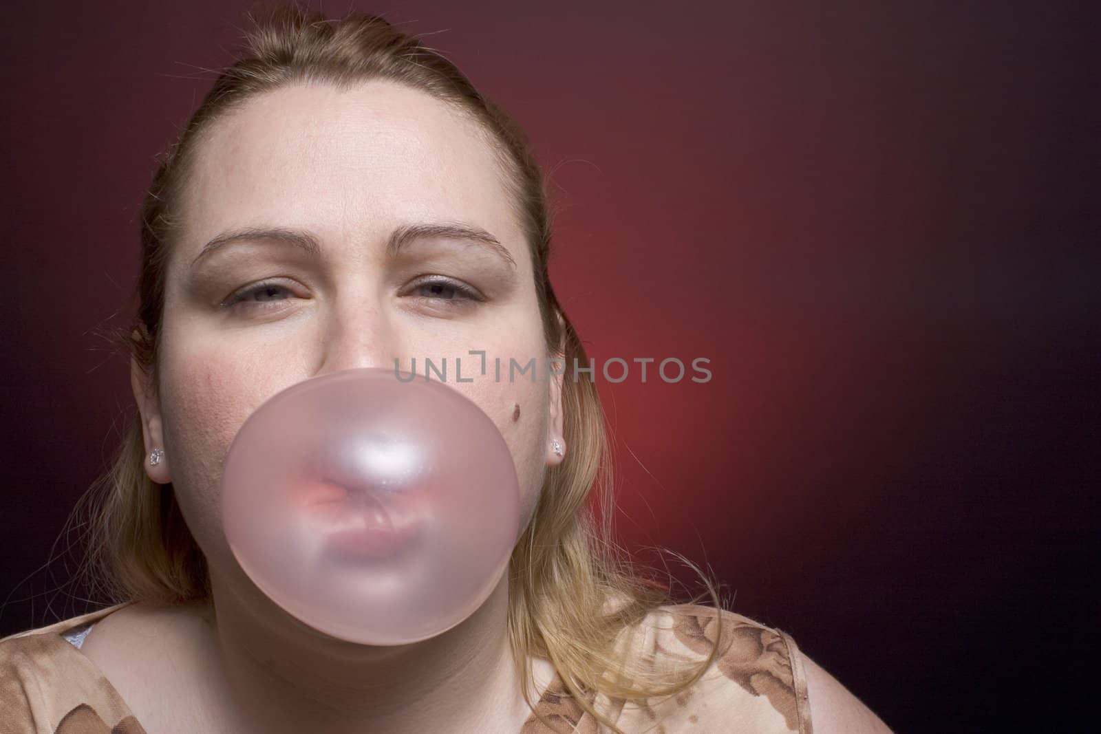 Women blowing big bubble by mypstudio