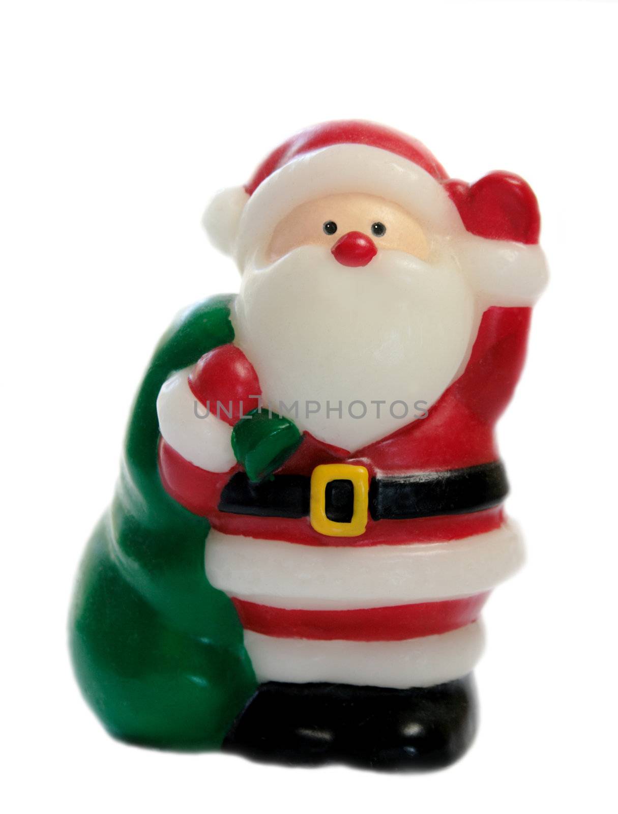 a Santa Claus figure with bright eyes and a green bag full of goodies