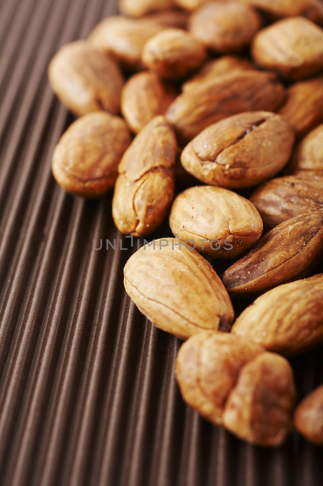 Roasted and sea salted almond nuts close-up 