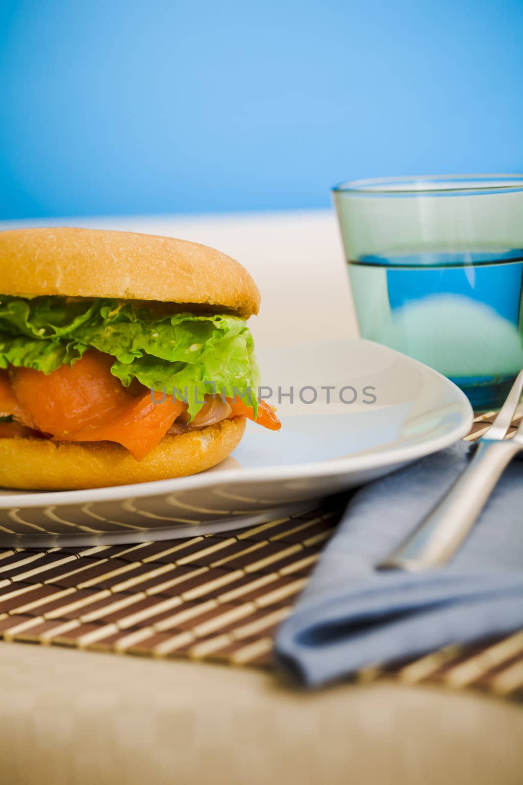 Cold smoked salmon bagel on the table