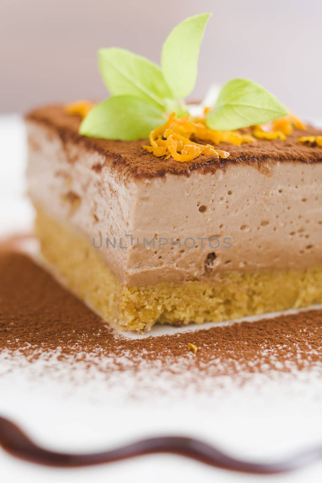 Mocca cheese cake with jam on coffee table (very shallow dof)