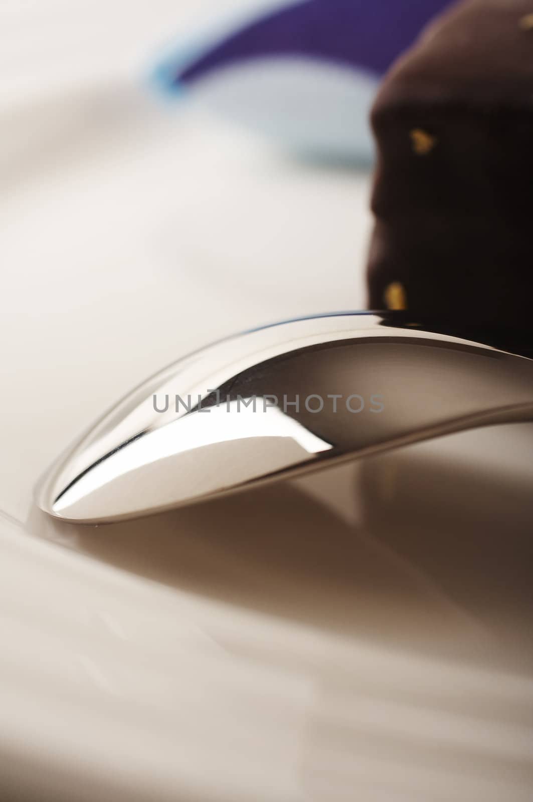 Spoon on the plate with chocolate cake