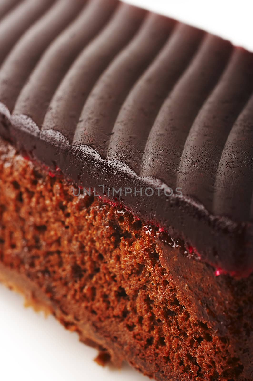 Chocolate cake with red jelly on the coffee table