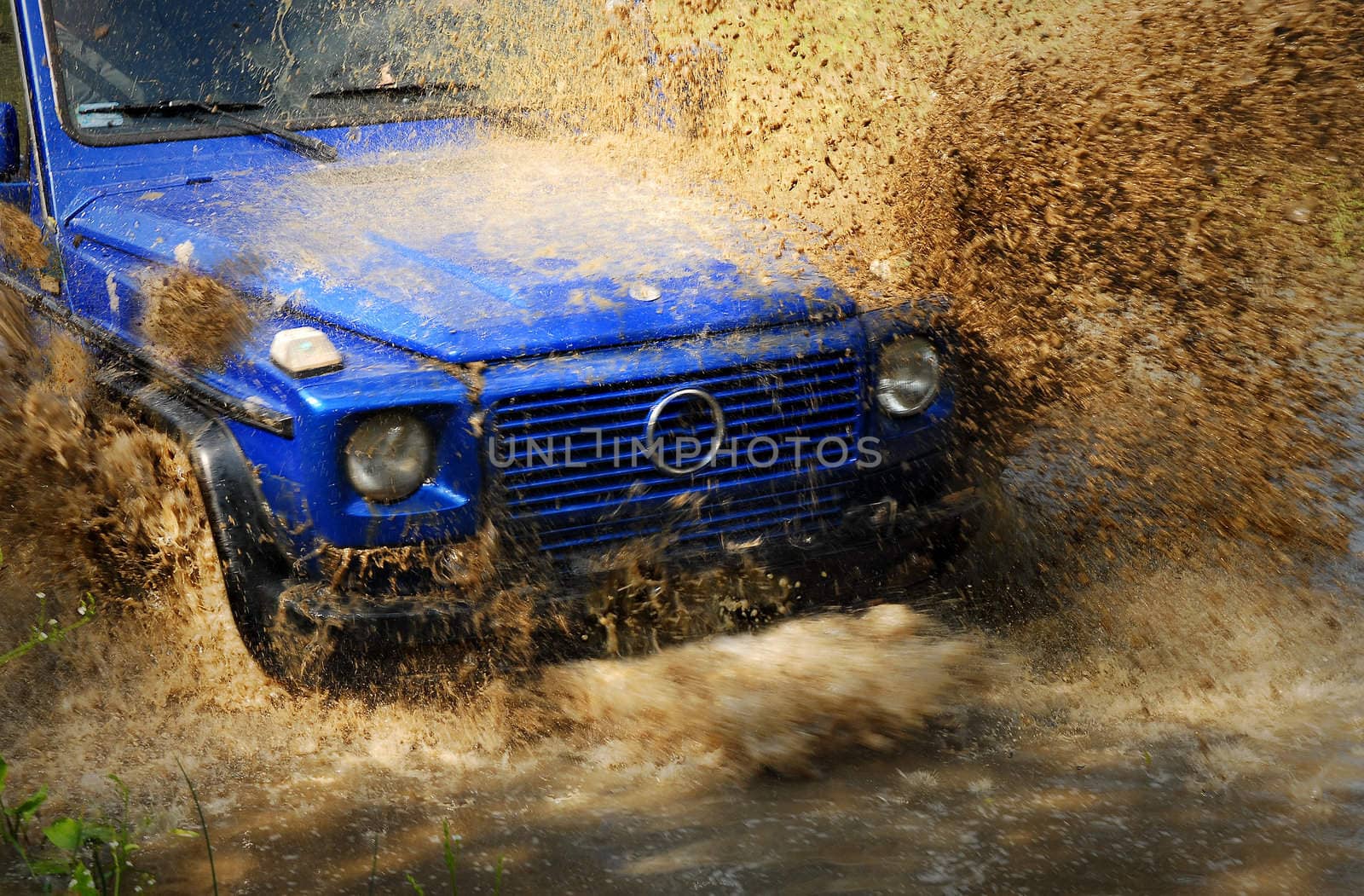 Off road car crossing deep mud