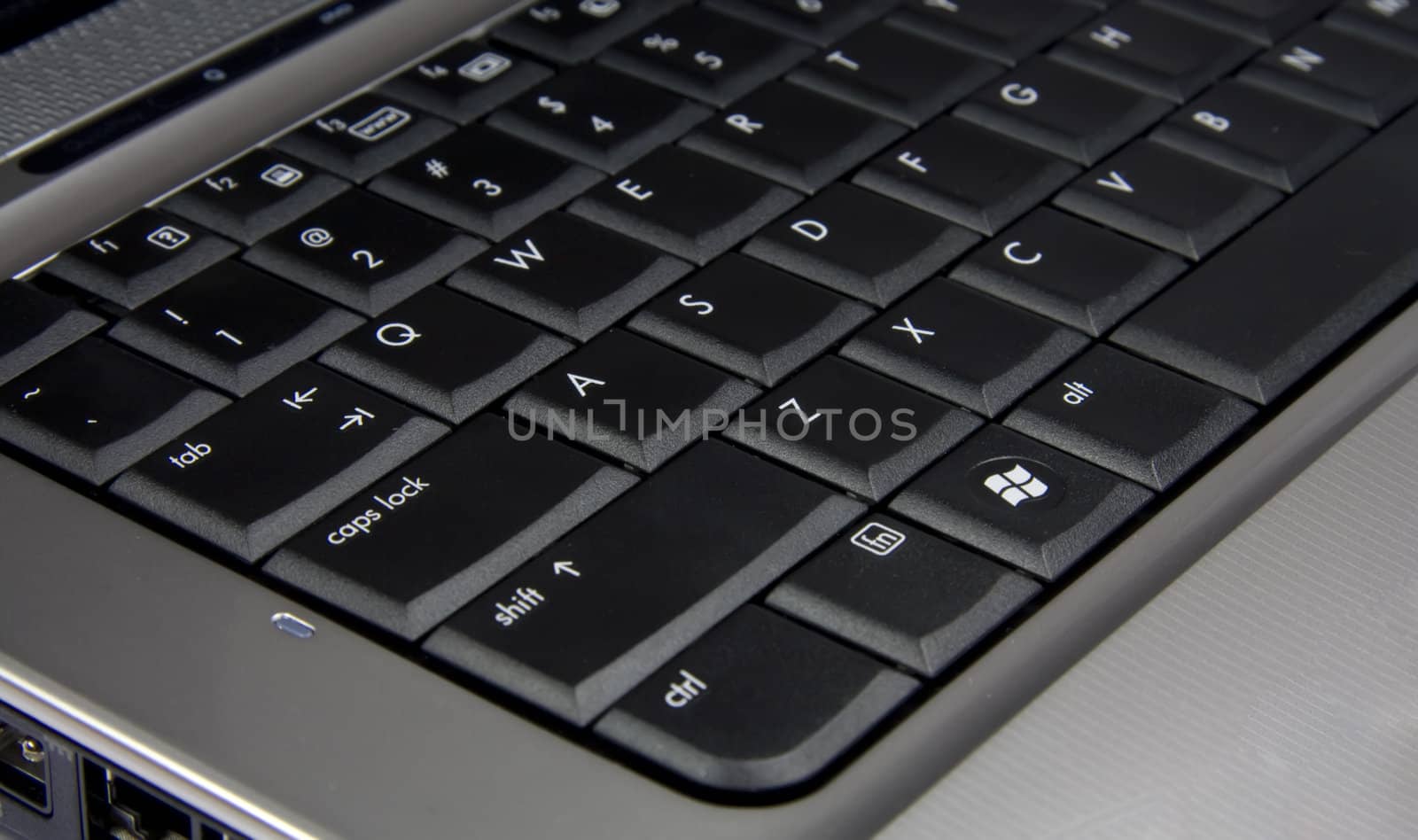 Silver laptop black keybord closeup