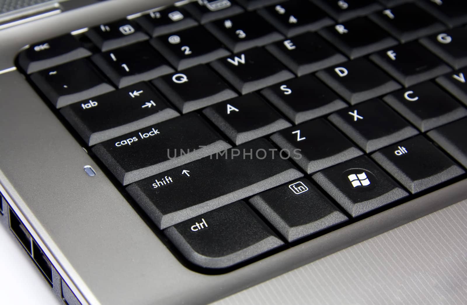 Silver laptop black keybord closeup