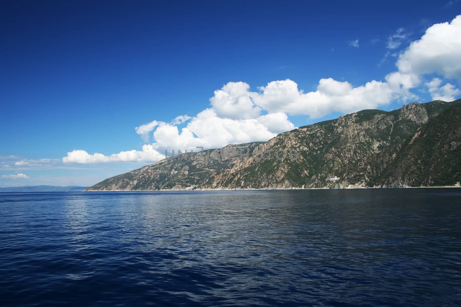 Tropical sea shore, blue sky and dark blue sea