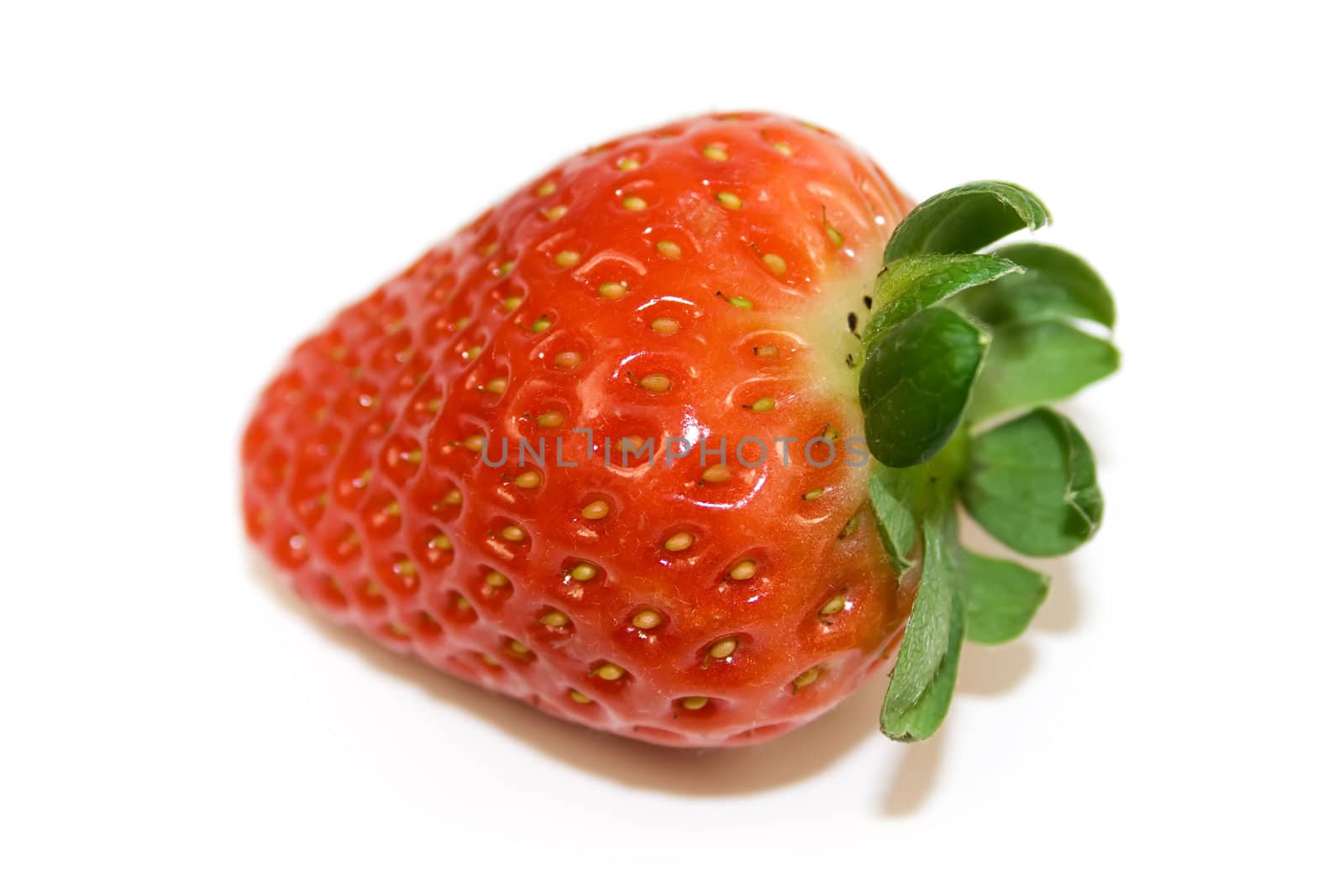 One strawberry closeup isolated on white