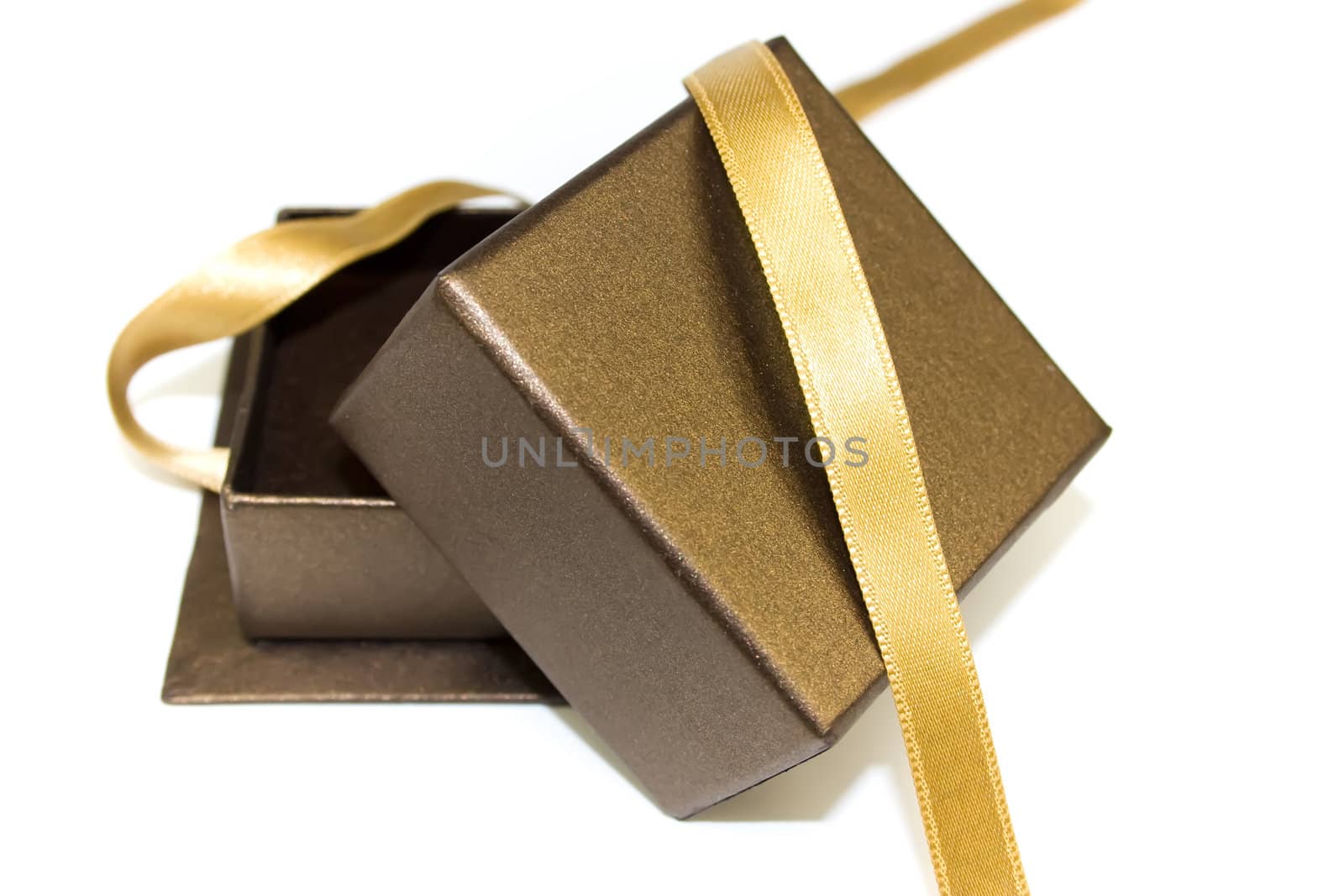 Open gift box with gold ribbon isolated on white