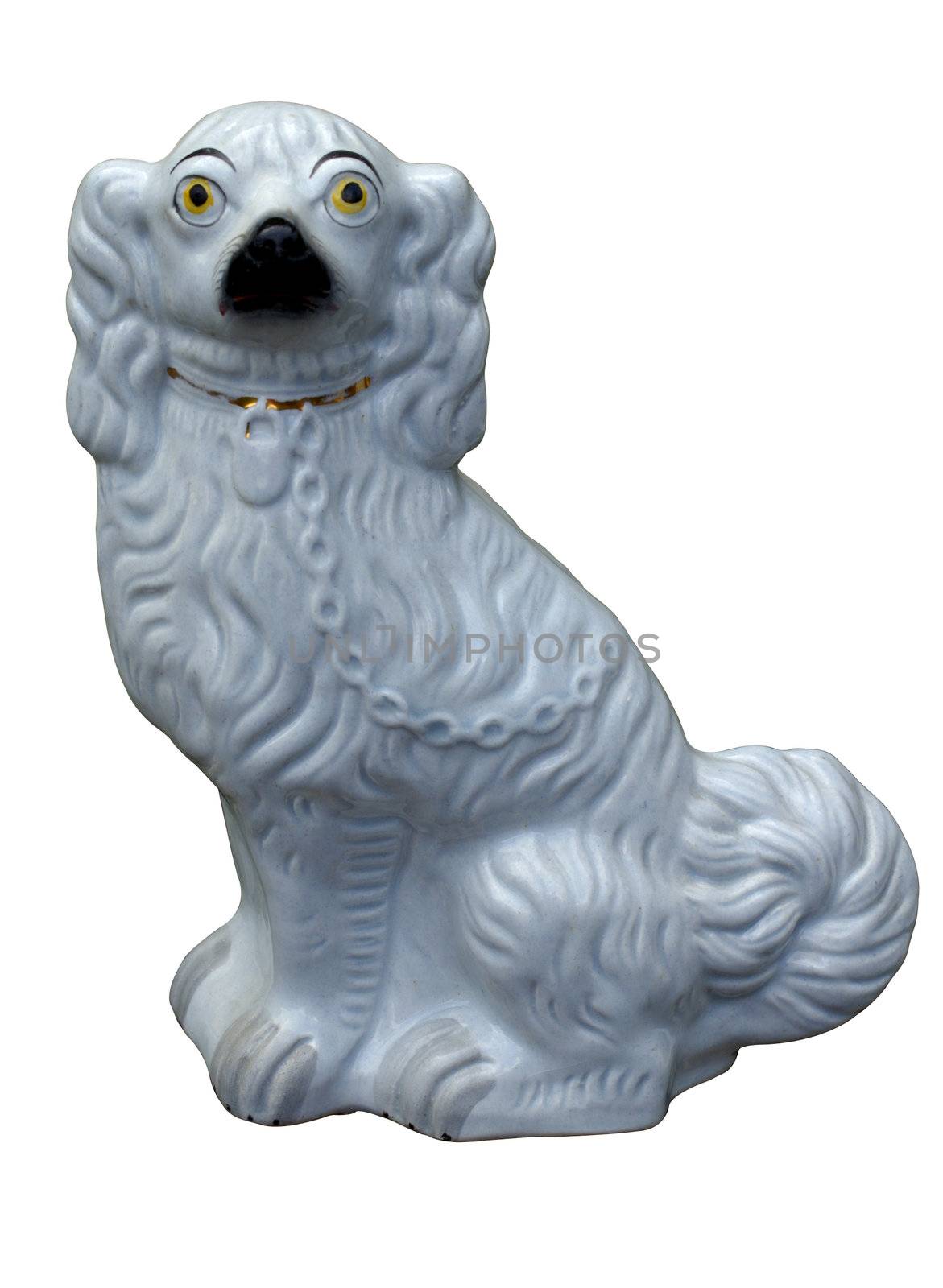 An antique Staffordshire pottery dog, on plain white background (with clipping path).