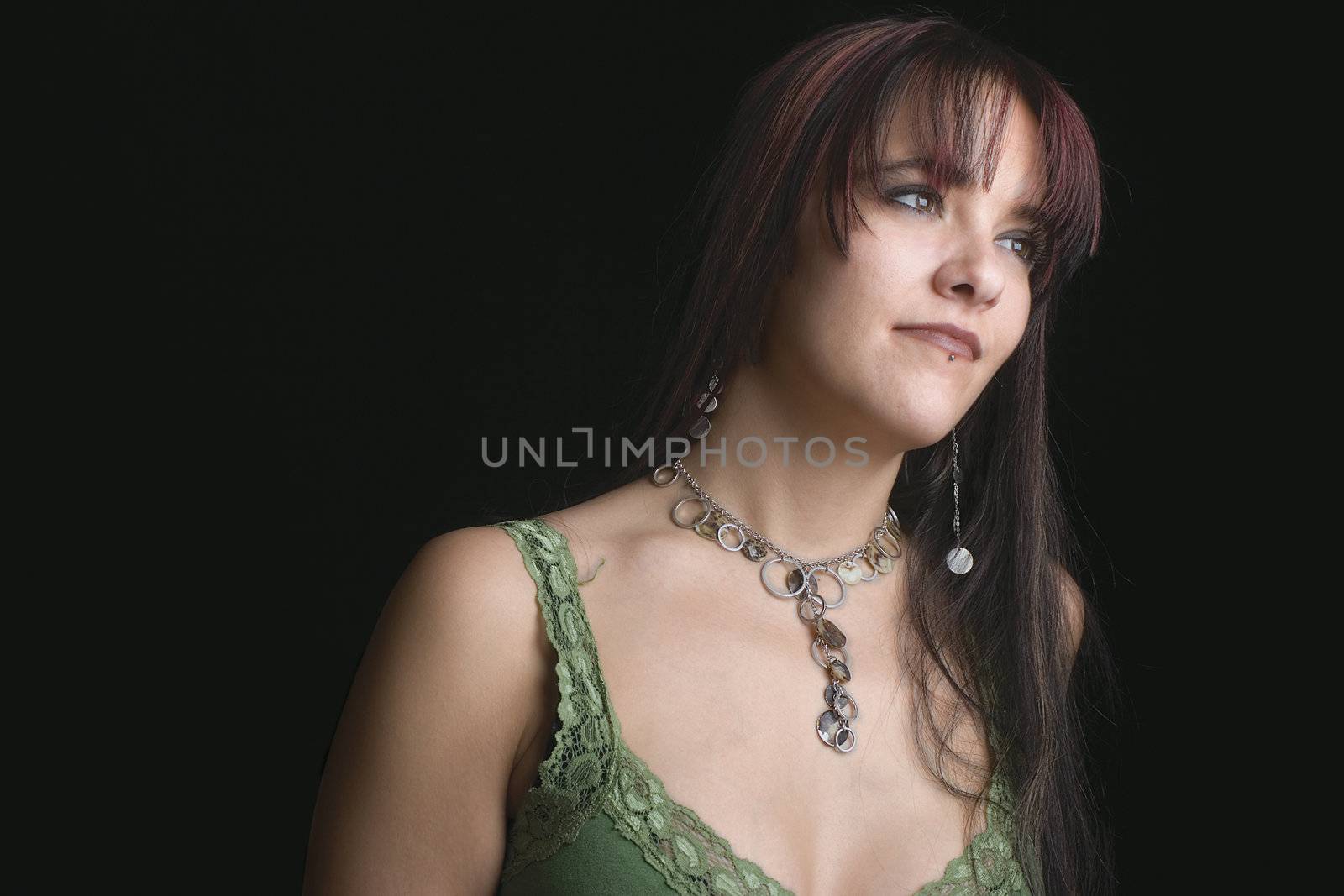 Close up portrait of fashion model in relaxe position with green tank top