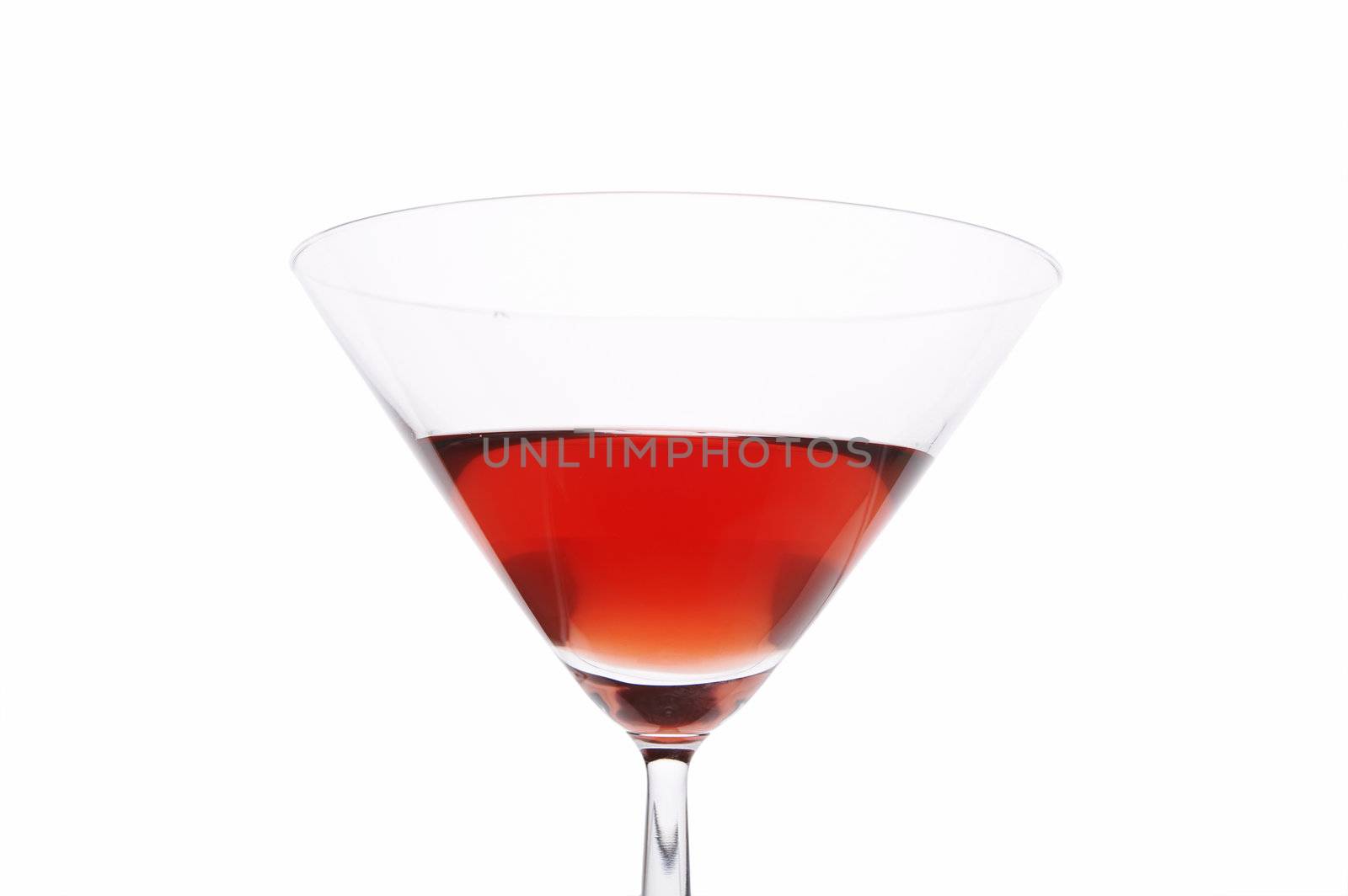 Red cocktail glass close up on white background