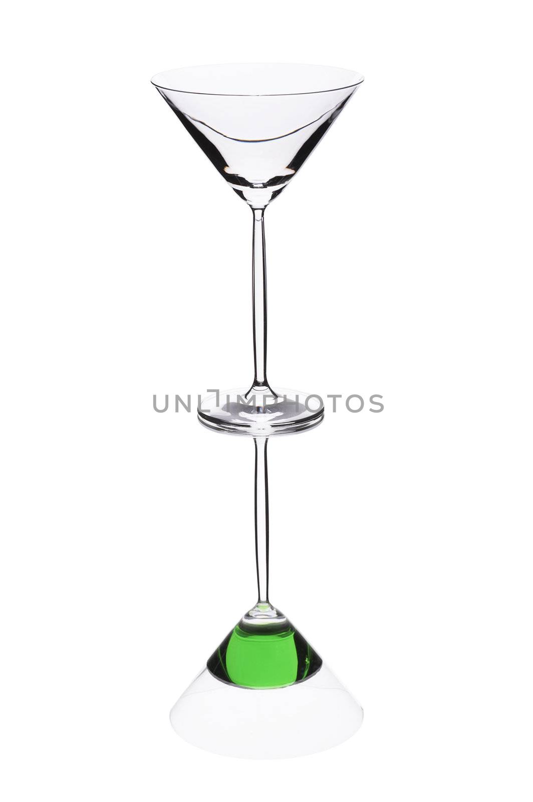 Empty cocktail glass on the white background with reflection.