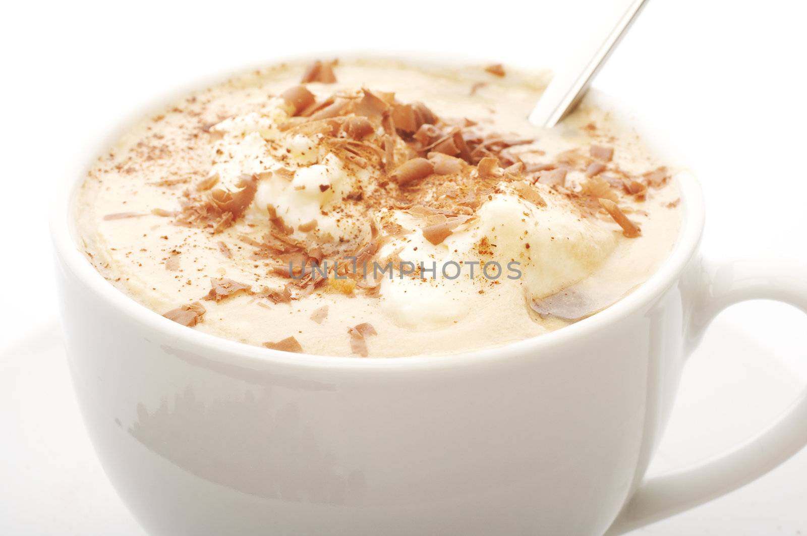 Macro close up of a coffee cup with cream top