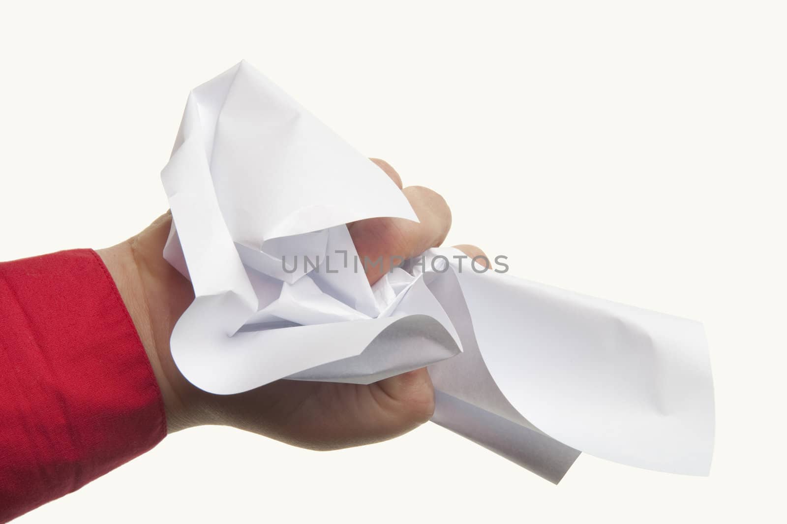 Anger represented by crumpled paper on white background
