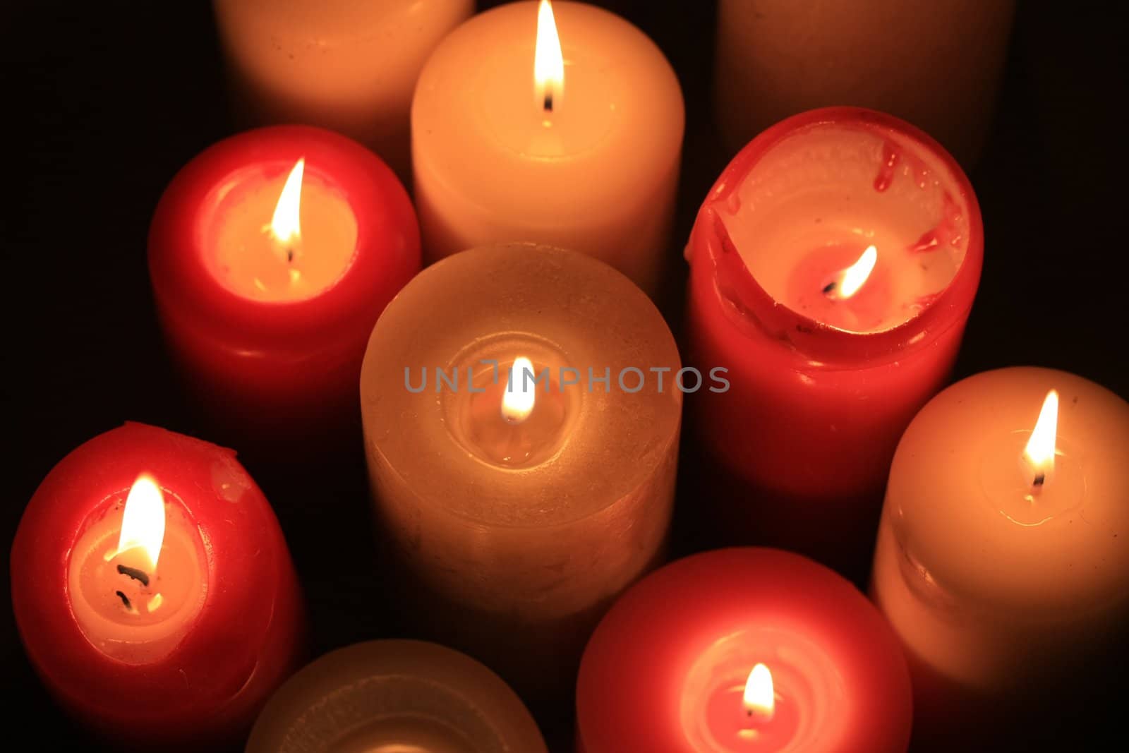 burning candles by studioportosabbia