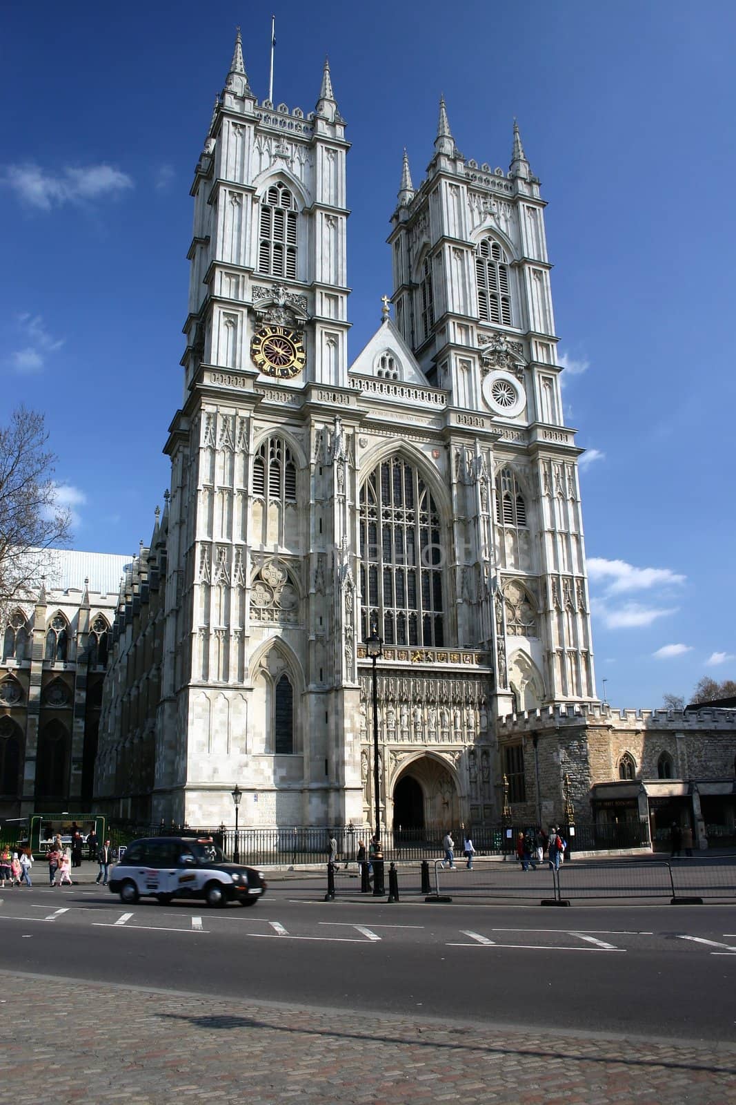 Westminster Abbey building with london black cab car