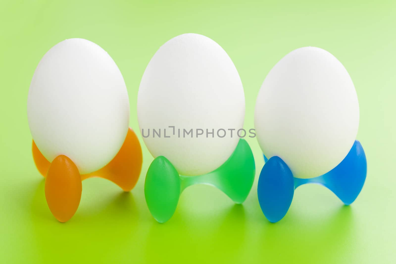 Alien looking eggs over a green background