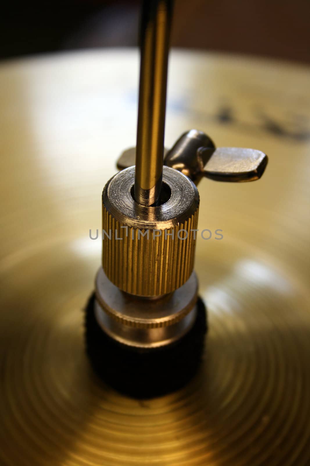 detail focus on the top of a set of brass drum kit symbols.