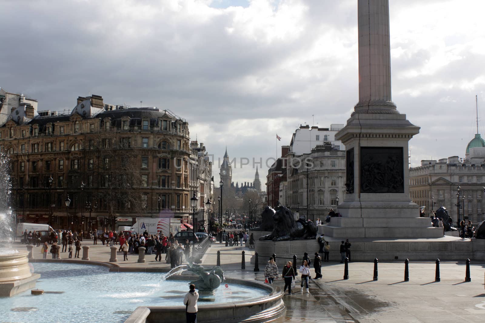 Looking across Trafalgar square in London towards the Houses of Parliment and Big Ben (St.Stephens Tower). Nelsons column in view with water fountains.