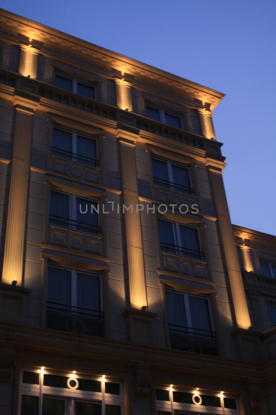 Detail of a hotel facade, lighted in the late afternoon