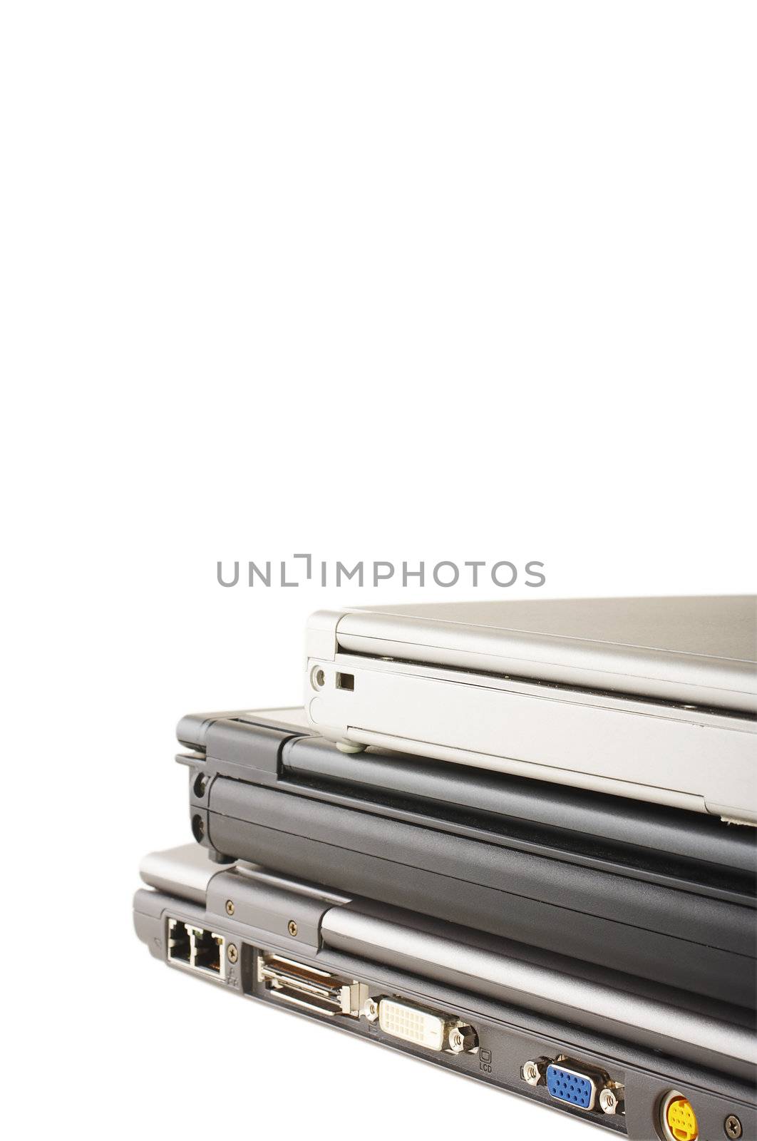 Three laptops stacked on the white background