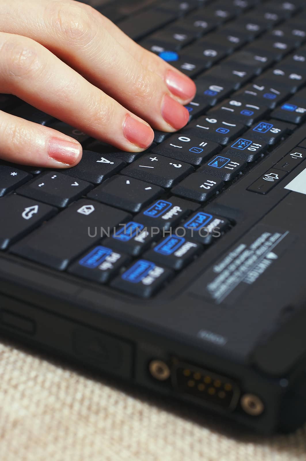 Woman typing with laptop