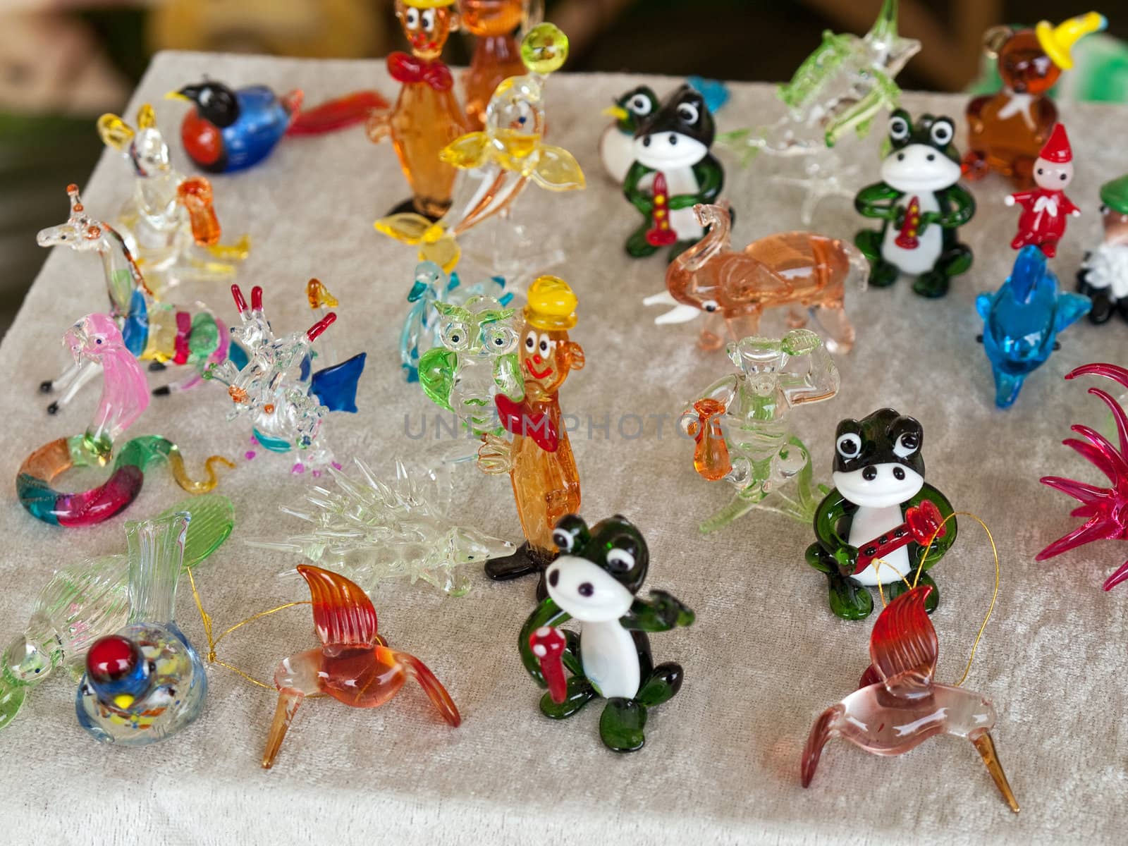 Colorful beautiful glass small animals figurines sculptures on display
