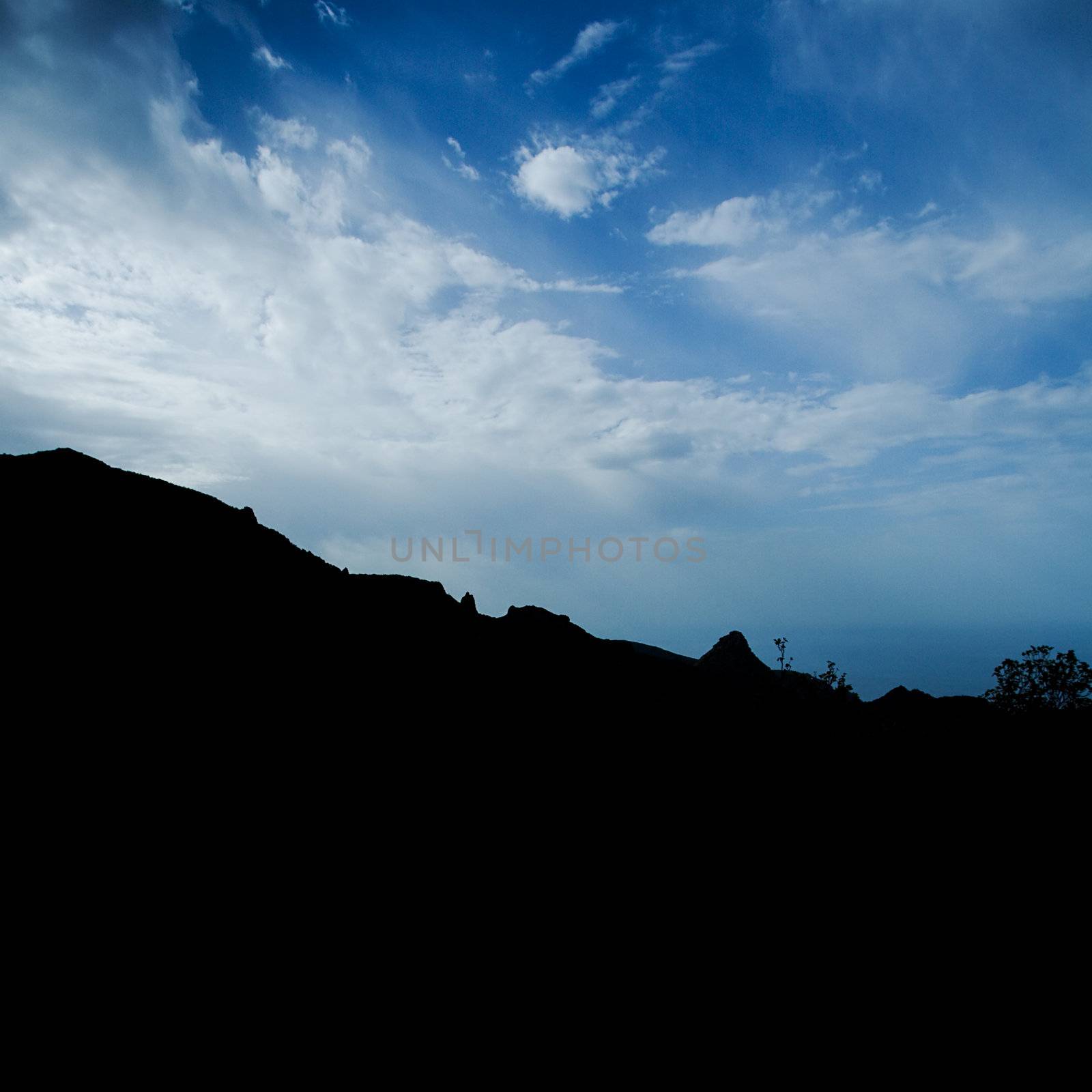 Mountain silhouette against the atlantic ocean and sky