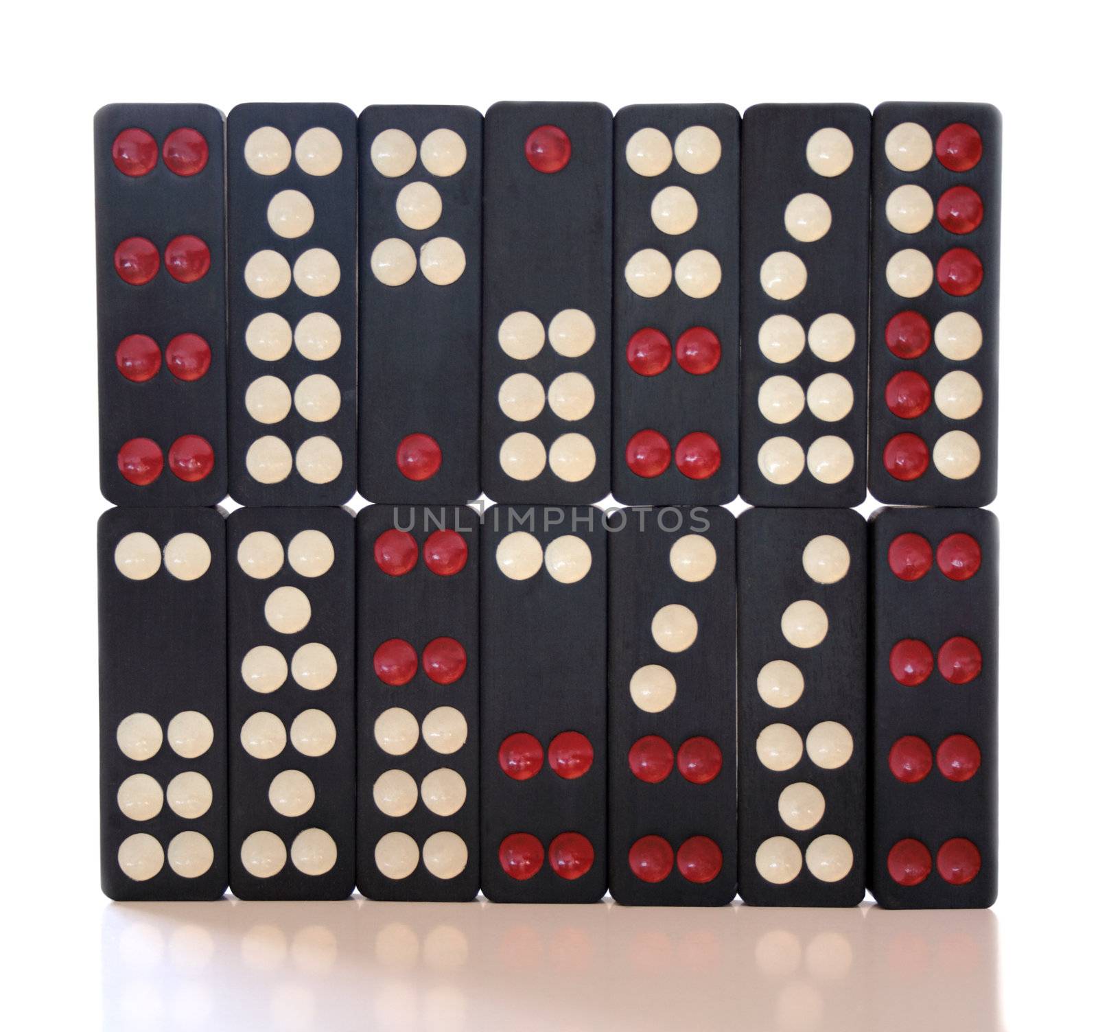 pieces from a well-used Chinese domino set, isolated on white