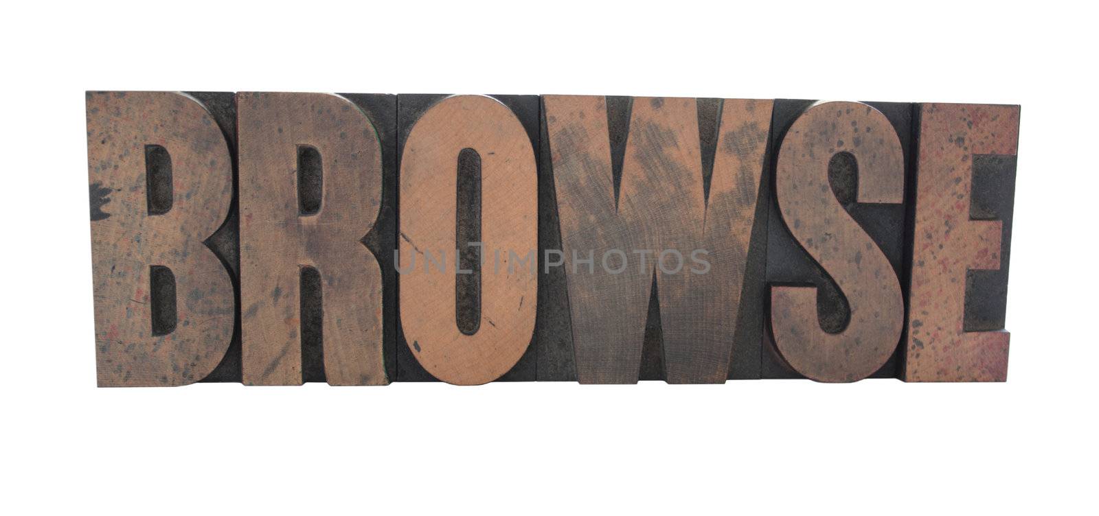 old, ink-stained wood letterpress type spells out the word 'Browse' isolated on white