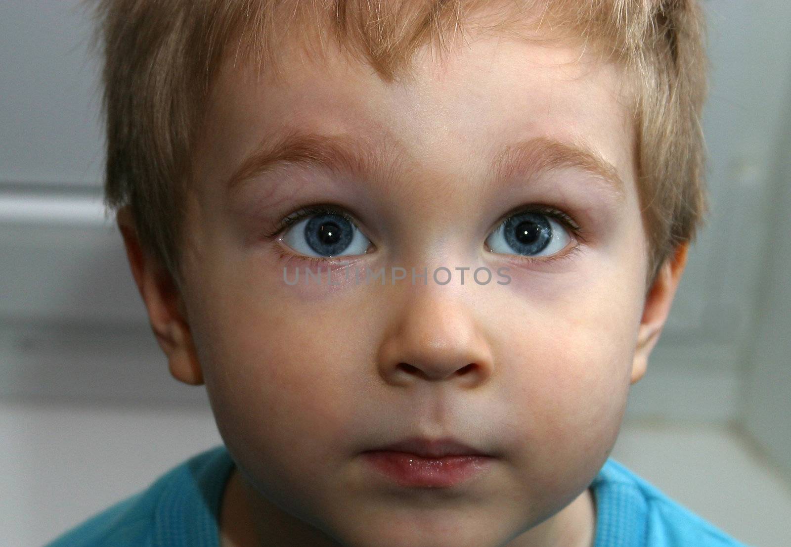 Portrait of the child looking upwards