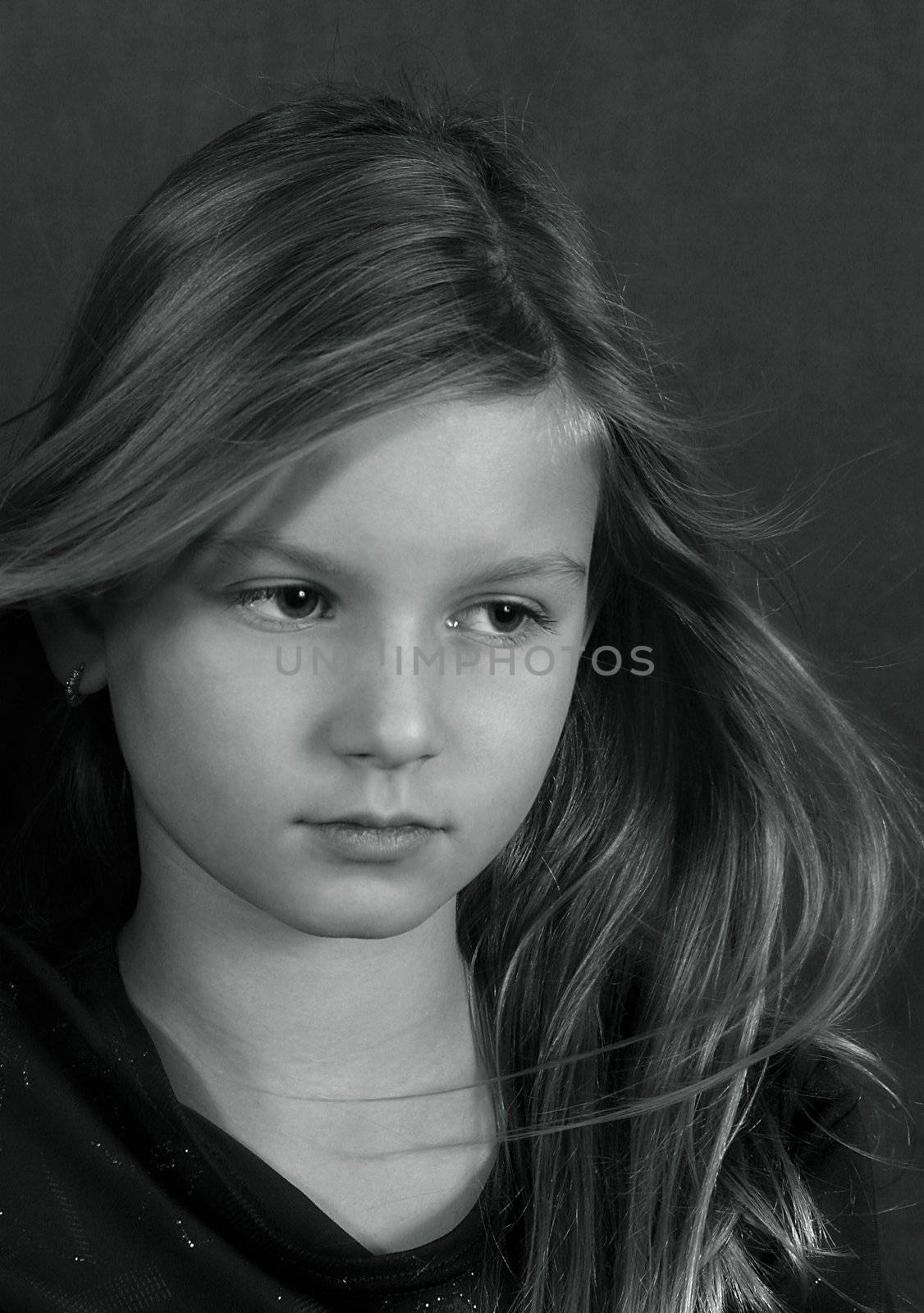 Portrait of the girl with fluttering hair