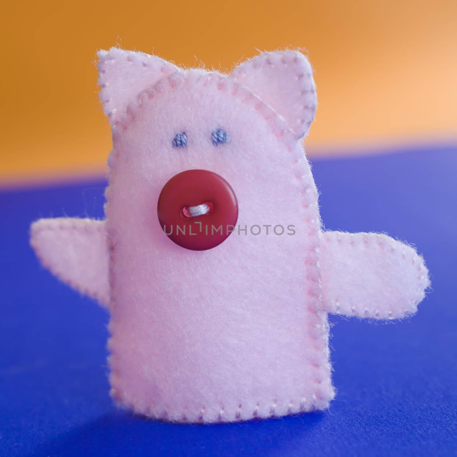 Finger puppet (farm animal: pig) on the table