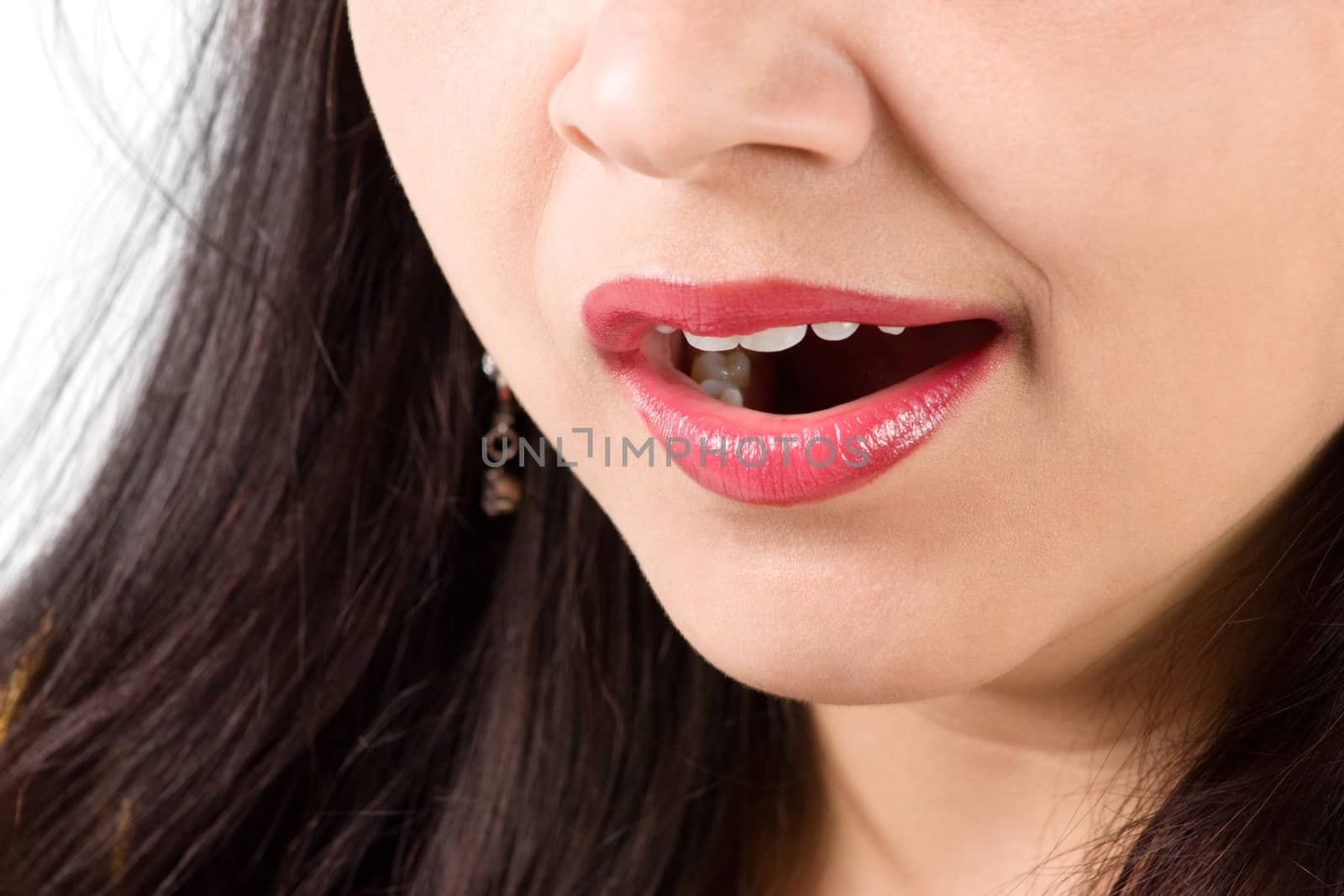 Tired young beautiful female taking yawning over white background 